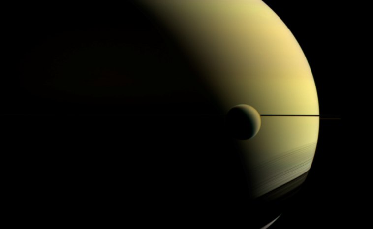 Titan is Saturn's largest moon and th eonly moon in our Solar System with a thick atmosphere and surface liquid.