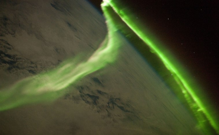 Aurora are a visual display that occurs when charged solar wind particles collide with gas particles in our atmosphere.