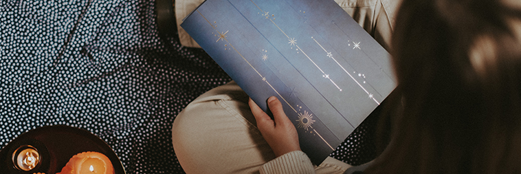 Someone sitting with the OSR Gift Pack on the ground